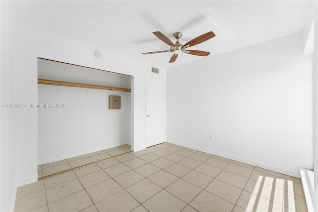 unfurnished bedroom featuring electric panel, ceiling fan, a closet, and visible vents