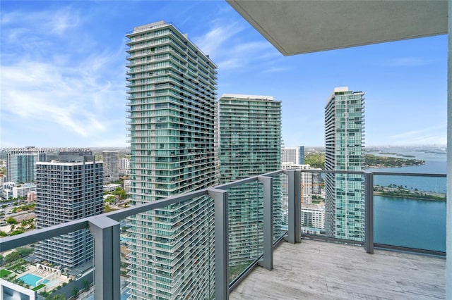 balcony featuring a water view and a view of city