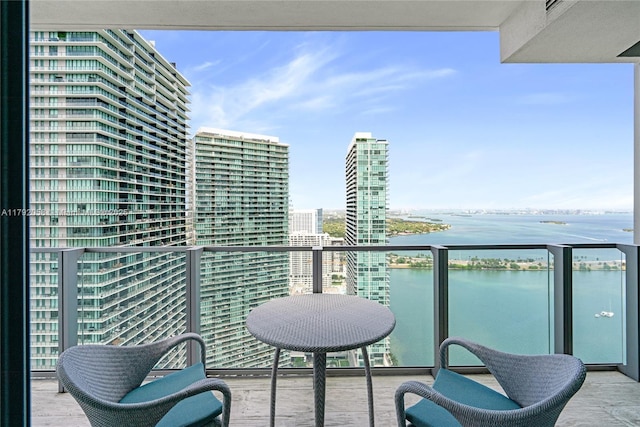 balcony featuring a water view