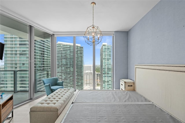 tiled bedroom featuring a chandelier and floor to ceiling windows