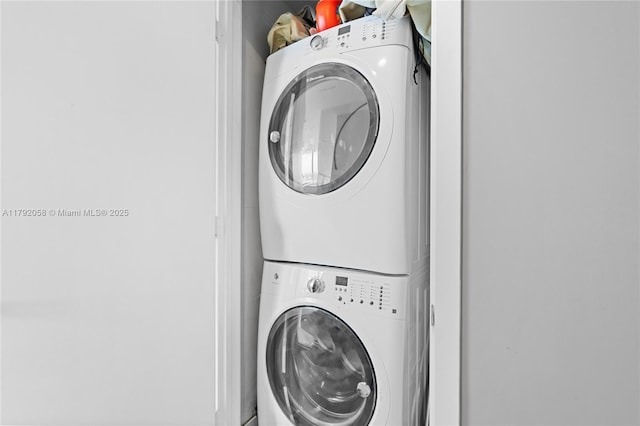 washroom featuring laundry area and stacked washer and clothes dryer