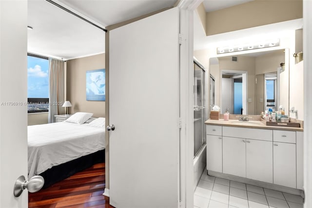 1330 W Ave Unit 3003, Miami Beach, FL 33139 - full bathroom with ensuite bath, visible vents, tile patterned flooring, vanity, and combined bath / shower with glass door