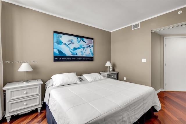 1330 W Ave Unit 3003, Miami Beach, FL 33139 - bedroom featuring baseboards, visible vents, and wood finished floors