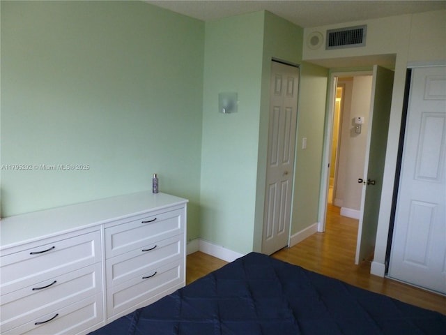 2801 NE 183rd St Unit 1507W, Aventura, FL 33160 - unfurnished bedroom featuring visible vents, light wood-style flooring, and baseboards
