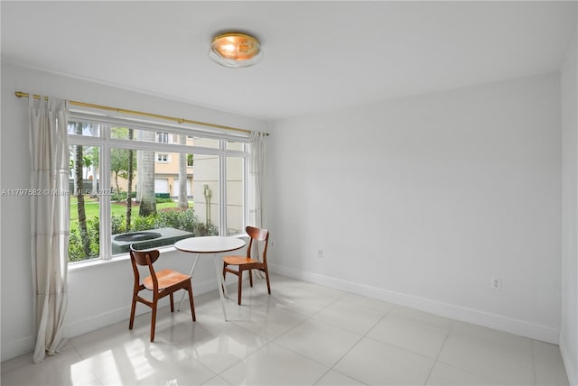18445 NE 27th Pl, Aventura, FL 33160 - dining space featuring baseboards and light tile patterned floors