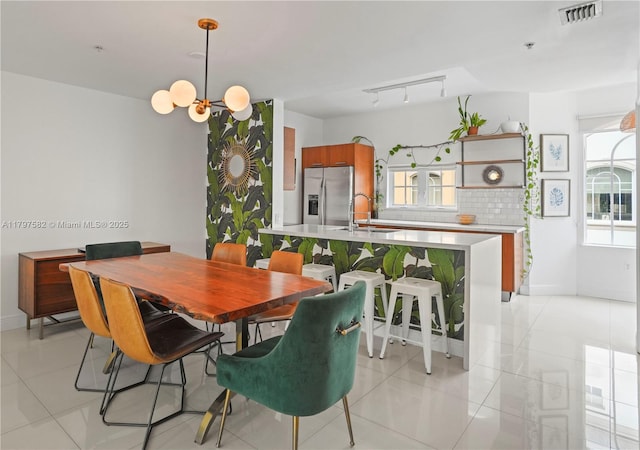 18445 NE 27th Pl, Aventura, FL 33160 - dining room featuring baseboards, a chandelier, visible vents, and light tile patterned flooring