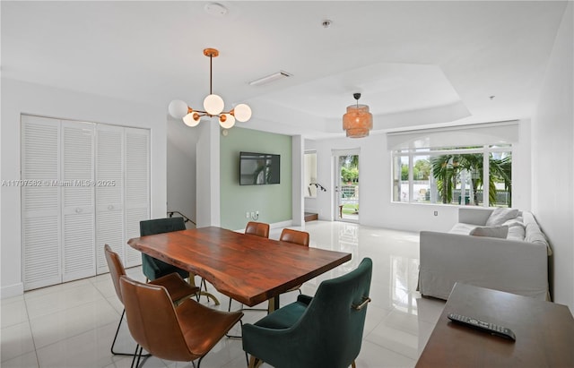 18445 NE 27th Pl, Aventura, FL 33160 - dining area with a tray ceiling, light tile patterned floors, visible vents, and baseboards