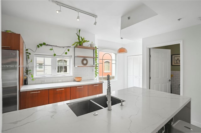 18445 NE 27th Pl, Aventura, FL 33160 - kitchen featuring a sink, stainless steel fridge, modern cabinets, and brown cabinets