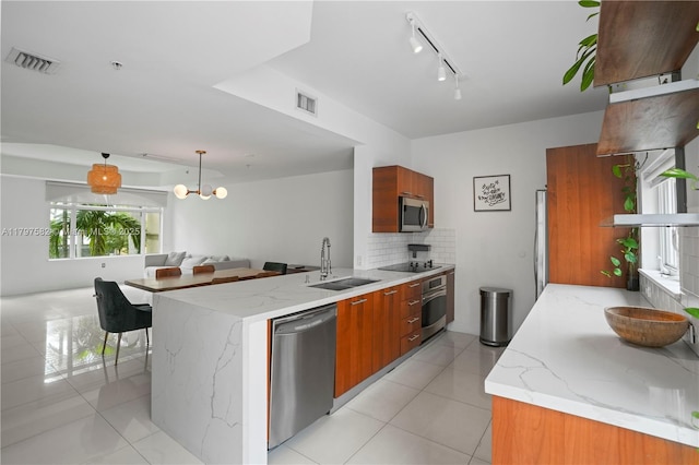 18445 NE 27th Pl, Aventura, FL 33160 - kitchen featuring light tile patterned floors, a sink, stainless steel appliances, visible vents, and backsplash