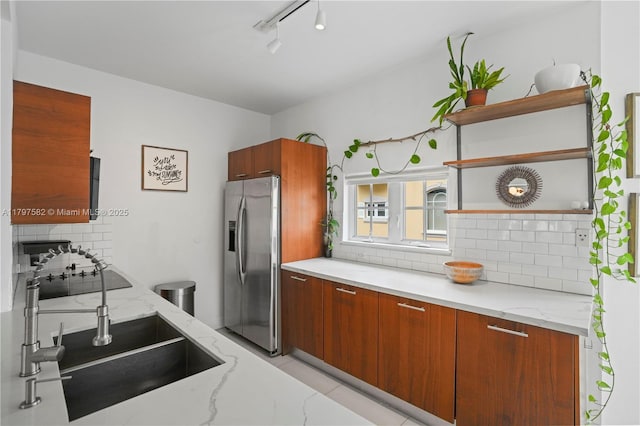 18445 NE 27th Pl, Aventura, FL 33160 - kitchen featuring a sink, open shelves, stainless steel refrigerator with ice dispenser, decorative backsplash, and modern cabinets