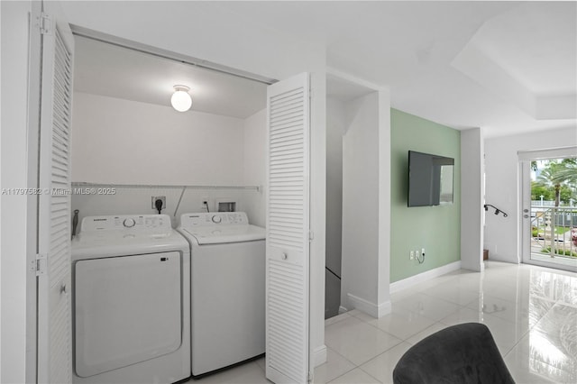 18445 NE 27th Pl, Aventura, FL 33160 - laundry room featuring separate washer and dryer, laundry area, baseboards, and light tile patterned flooring