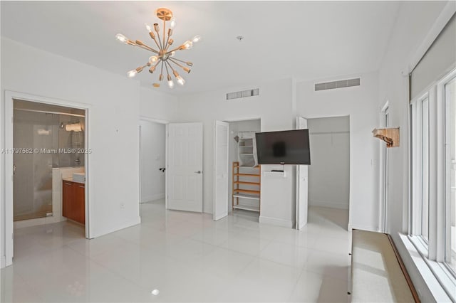 18445 NE 27th Pl, Aventura, FL 33160 - unfurnished bedroom with a notable chandelier, visible vents, and multiple windows