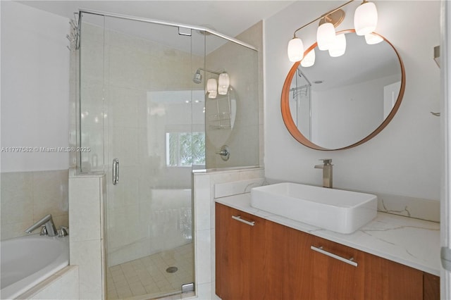 18445 NE 27th Pl, Aventura, FL 33160 - bathroom featuring a shower stall, a garden tub, and vanity