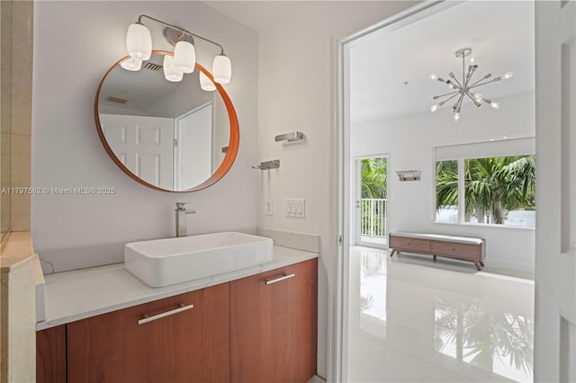 18445 NE 27th Pl, Aventura, FL 33160 - bathroom with vanity and a chandelier