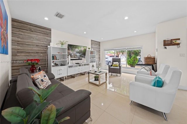 tiled living area with visible vents and recessed lighting