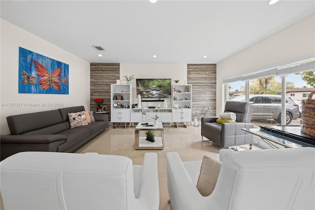living room with recessed lighting and visible vents