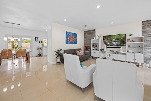 living room featuring light tile patterned floors, visible vents, and recessed lighting