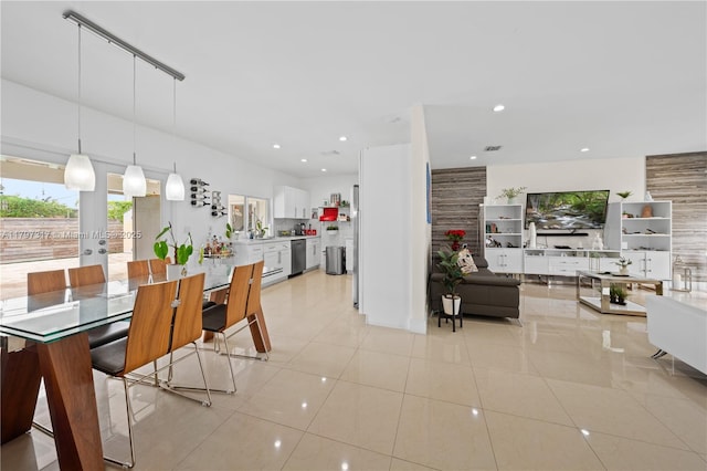 dining area with light tile patterned floors and recessed lighting