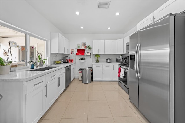 1730 SW 97th Ct, Miami, FL 33165 - kitchen with french doors, a sink, stainless steel appliances, white cabinetry, and light countertops