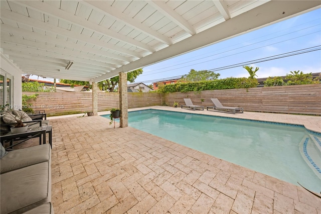 view of swimming pool featuring a patio, a fenced backyard, and a fenced in pool