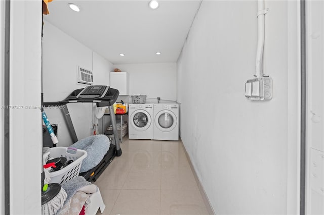 laundry area featuring baseboards, washer and dryer, recessed lighting, and light tile patterned flooring