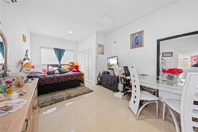 bedroom with recessed lighting, attic access, light tile patterned floors, and multiple windows