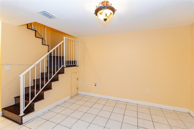 interior space with baseboards and visible vents