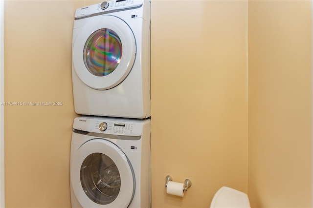 laundry area featuring laundry area and stacked washer / dryer
