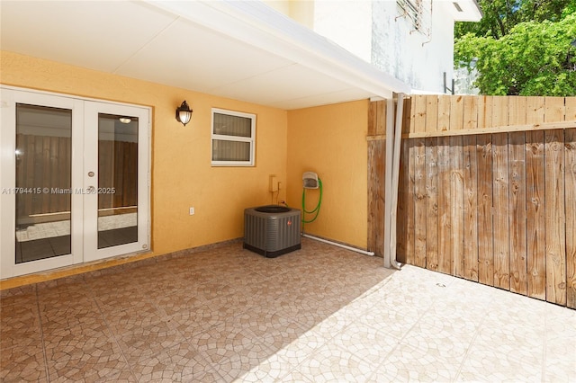 view of patio featuring cooling unit and french doors