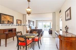 dining room with light tile patterned flooring