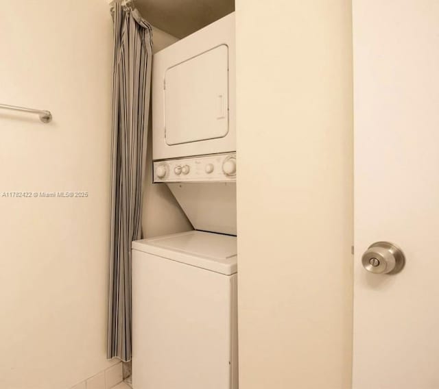 20850 San Simeon Way Unit 408-5, Miami, FL 33179 - washroom with stacked washer / dryer and laundry area