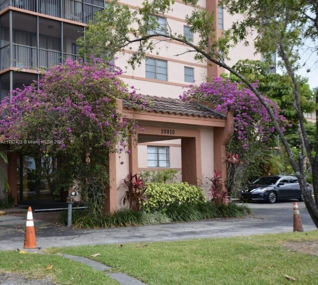 20850 San Simeon Way Unit 408-5, Miami, FL 33179 - view of front facade featuring stucco siding and a tile roof