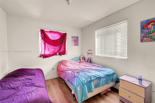 21133 NW 14th Pl, Miami Gardens, FL 33169 - bedroom featuring wood finished floors and baseboards