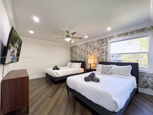 bedroom featuring crown molding, baseboards, ceiling fan, and dark wood-style floors
