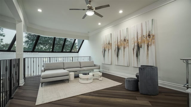living area featuring crown molding, wood finished floors, baseboards, and a ceiling fan