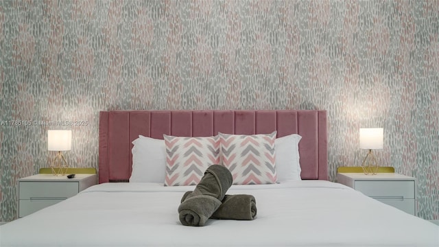 bedroom featuring wallpapered walls