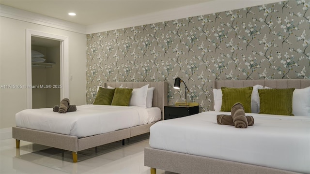 bedroom featuring wallpapered walls and recessed lighting