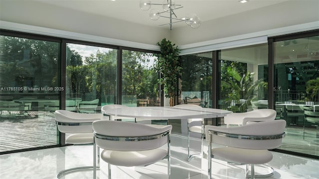 sunroom with a chandelier