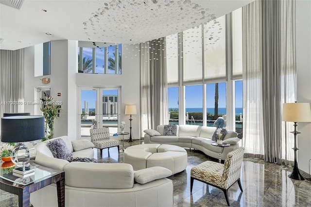 17201 Collins Ave Unit 1605, Sunny Isles Beach, FL 33160 - living area with a high ceiling, plenty of natural light, a water view, and marble tiled floors