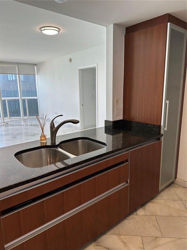 17201 Collins Ave Unit 1605, Sunny Isles Beach, FL 33160 - kitchen with a sink and dark stone countertops