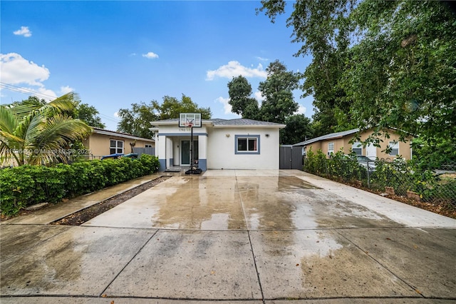 1793 NW 93rd Ter, Miami, FL 33147 - bungalow-style home with concrete driveway, stucco siding, and fence