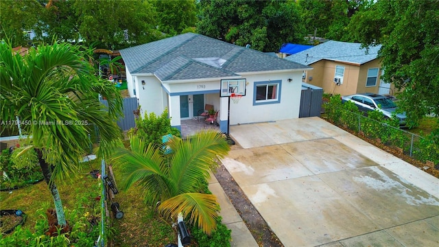 1793 NW 93rd Ter, Miami, FL 33147 - bungalow with concrete driveway, a shingled roof, stucco siding, and fence