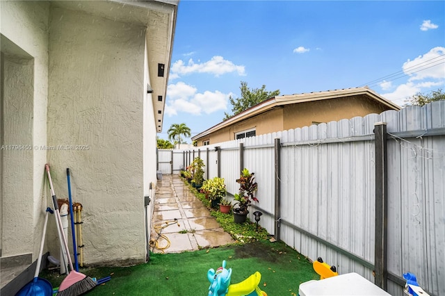 1793 NW 93rd Ter, Miami, FL 33147 - view of side of property featuring a fenced backyard and stucco siding