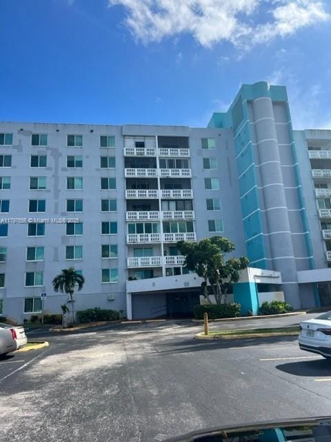 919 Hillcrest Dr Unit 611, Hollywood, FL 33021 - view of apartment building / complex with uncovered parking