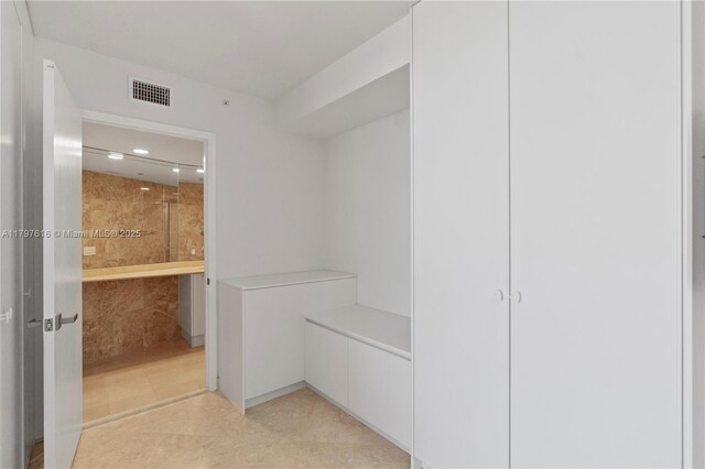 18911 Collins Ave Unit 3307, Sunny Isles Beach, FL 33160 - walk in closet featuring light tile patterned floors