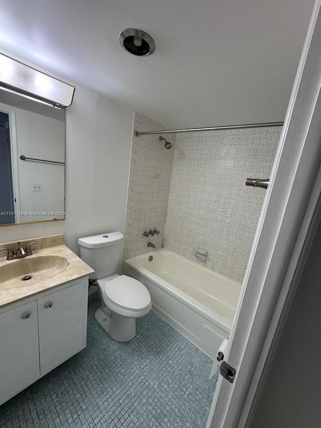 bathroom with vanity, toilet, shower / tub combination, and tile patterned flooring