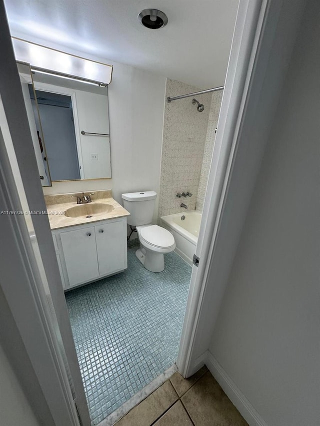 full bath with toilet, shower / tub combination, vanity, tile patterned floors, and baseboards