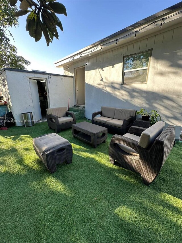 1874 NW 65th St, Miami, FL 33147 - view of yard featuring outdoor lounge area