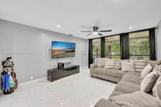 living area with plenty of natural light, baseboards, a ceiling fan, and recessed lighting