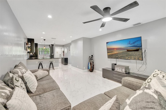 living room featuring marble finish floor, ceiling fan, recessed lighting, and visible vents